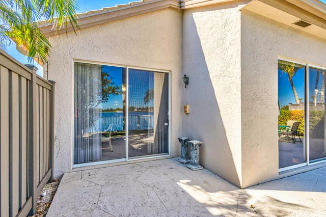 a view of a house with a door and wooden floor