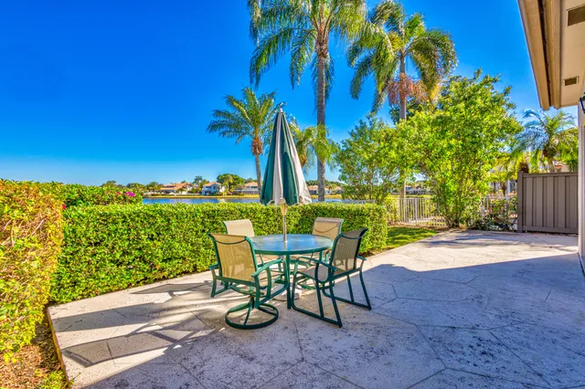 a front view of a house with a garden and deck