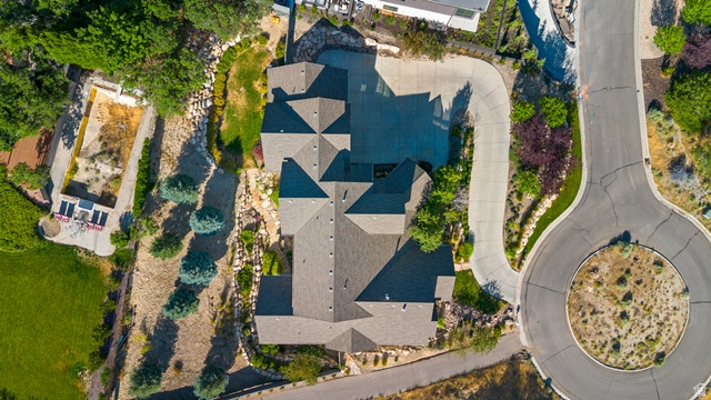 3 Carriagewood Cove, Unit 1088 Sandy, UT 84092 - Photo 67 of 79 Expansive property featuring a multi-gabled roofline, substantial paved driveway, and varied landscaping