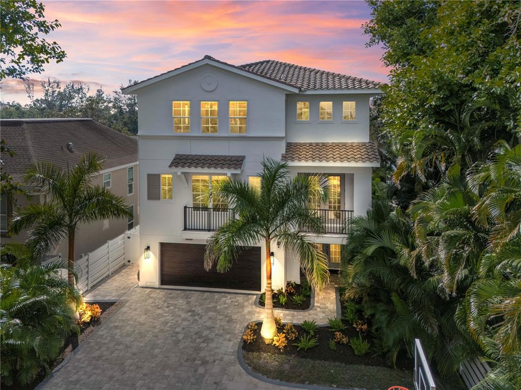 8008 Midnight Pass Road Sarasota, FL 34242 - Photo 1 of 61 a front view of a house with a yard