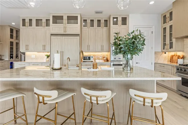 a kitchen with a table and chairs in it