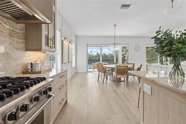 a kitchen with stove and cabinets