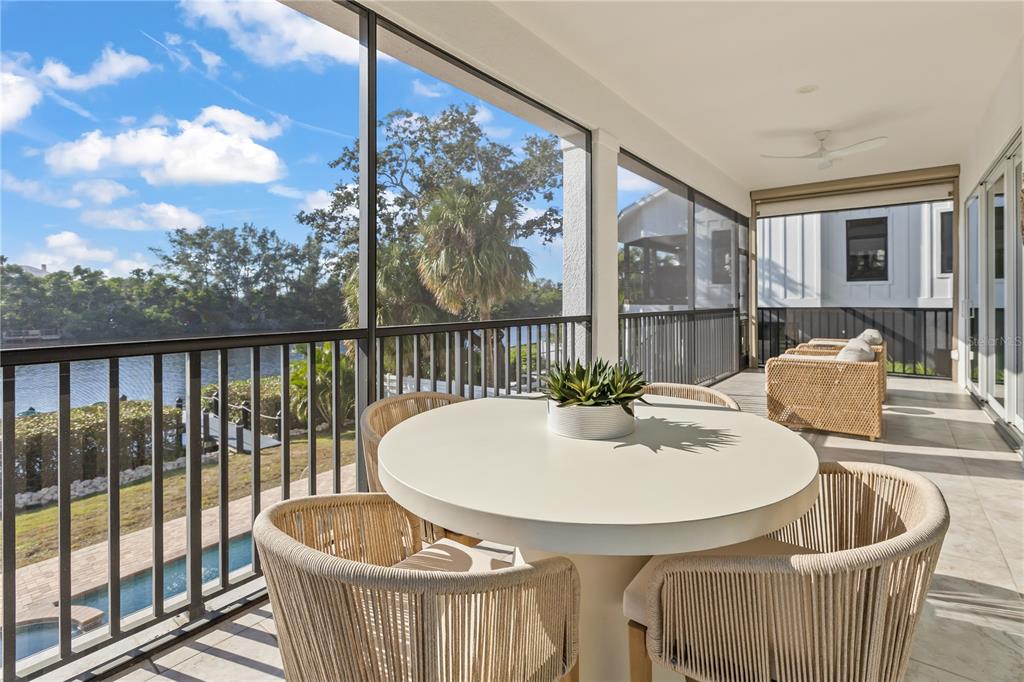 8008 Midnight Pass Road Sarasota, FL 34242 - Photo 22 of 61 a outdoor dining space with furniture and outdoor view