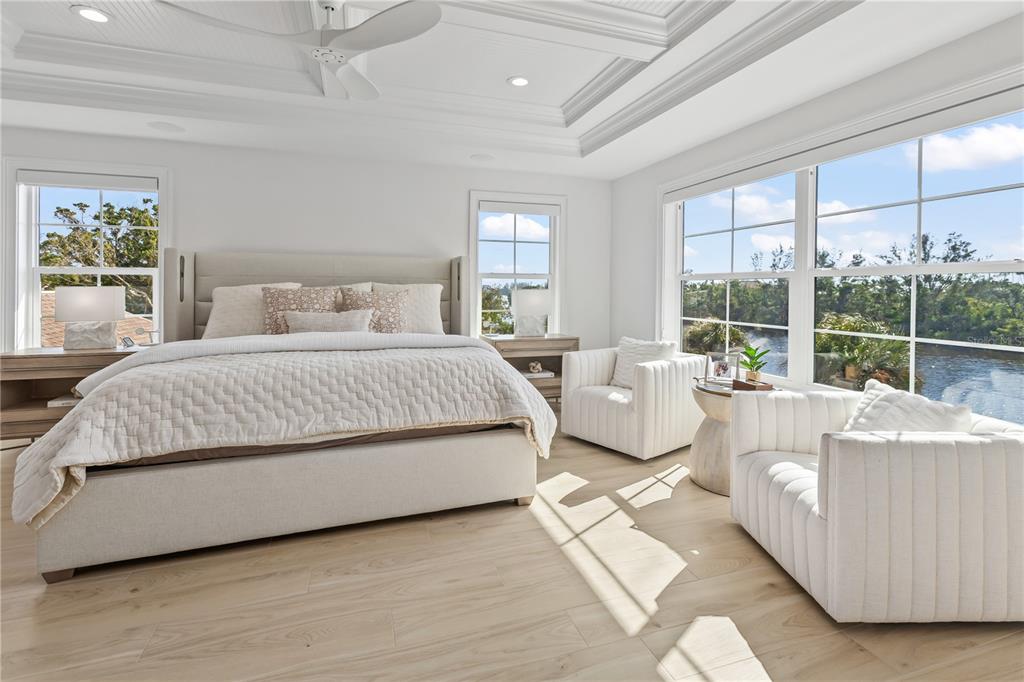 8008 Midnight Pass Road Sarasota, FL 34242 - Photo 23 of 61 a bedroom with a large bed and a large window