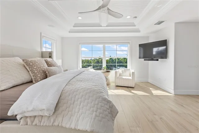 a spacious bathroom with a tub sink and mirror