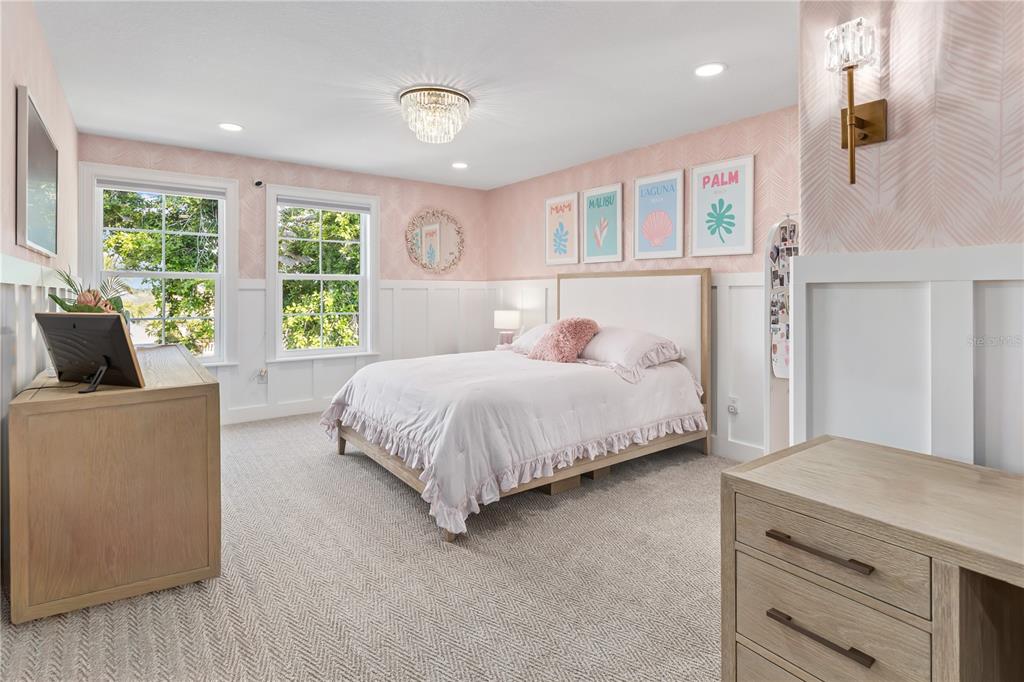 8008 Midnight Pass Road Sarasota, FL 34242 - Photo 27 of 61 a bedroom with a large bed and a couch