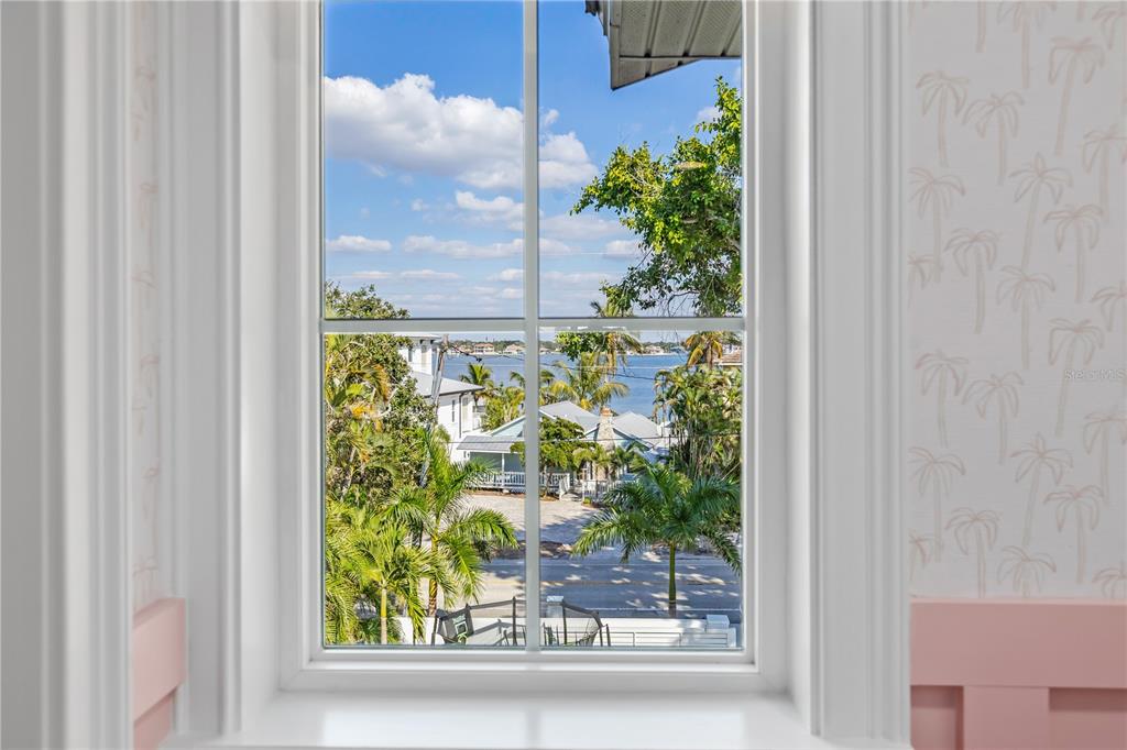 8008 Midnight Pass Road Sarasota, FL 34242 - Photo 30 of 61 a picture of a window and a tree