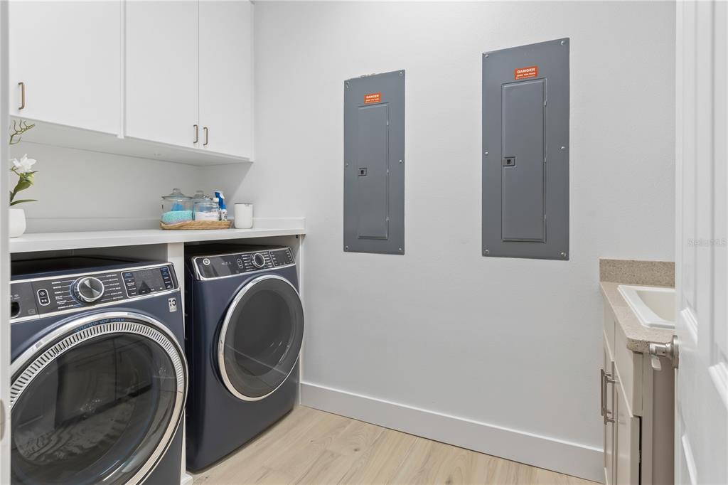 8008 Midnight Pass Road Sarasota, FL 34242 - Photo 40 of 61 a utility room with dryer and washer