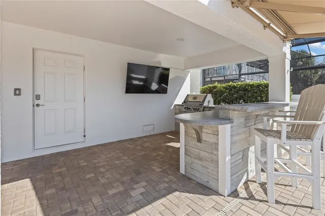 a view of a house with backyard porch and sitting area