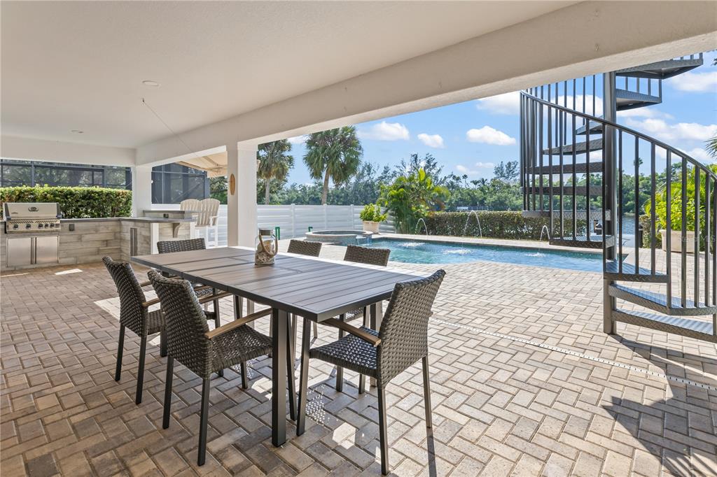 8008 Midnight Pass Road Sarasota, FL 34242 - Photo 45 of 61 a view of a dining room with furniture window and outside view