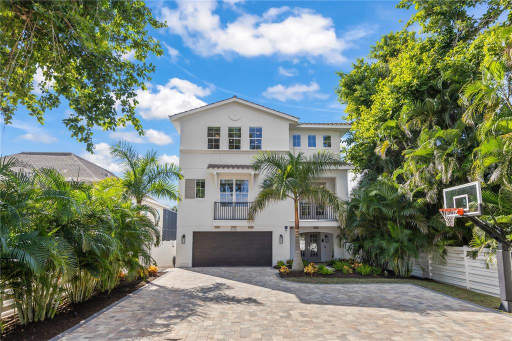 8008 Midnight Pass Road Sarasota, FL 34242 - Photo 49 of 61 a front view of a house with a yard and tree s