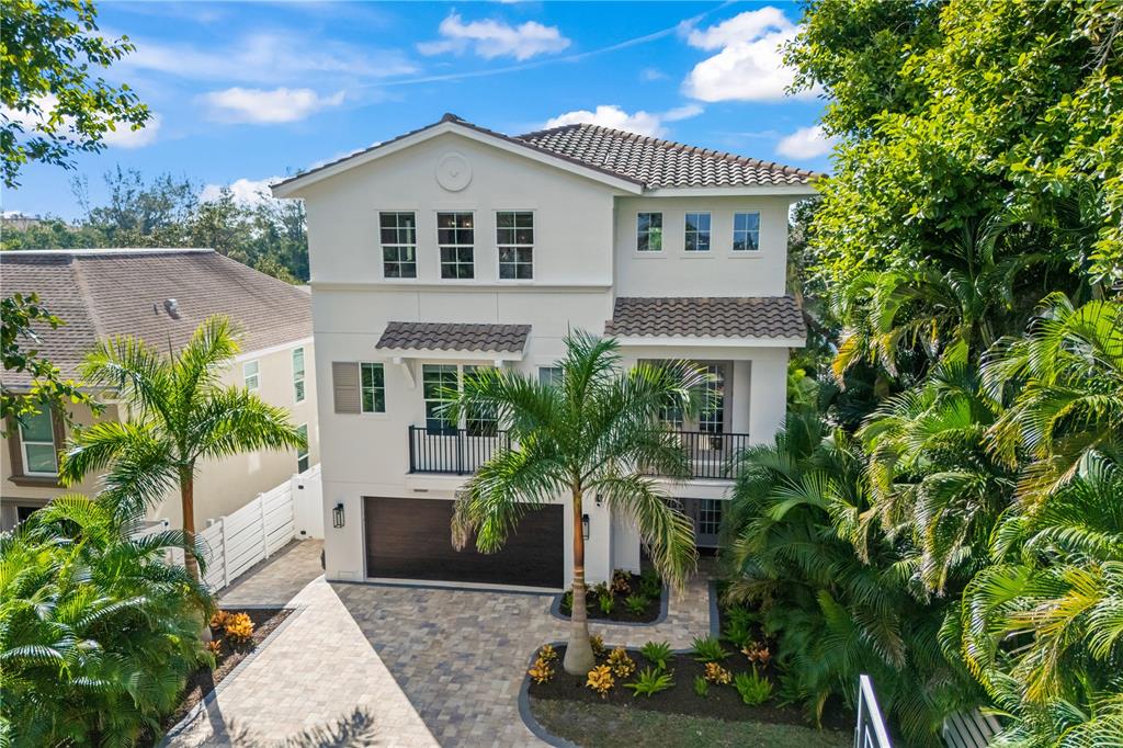 8008 Midnight Pass Road Sarasota, FL 34242 - Photo 50 of 61 a front view of a house with a yard