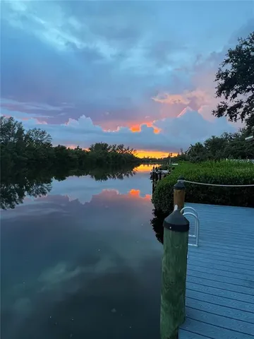 a picture of a lake with a building in the background