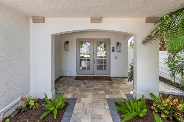 a view of a entryway with flower pots
