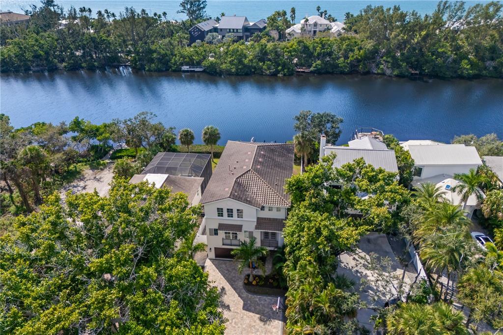 8008 Midnight Pass Road Sarasota, FL 34242 - Photo 61 of 61 an aerial view of a house with outdoor space and lake view
