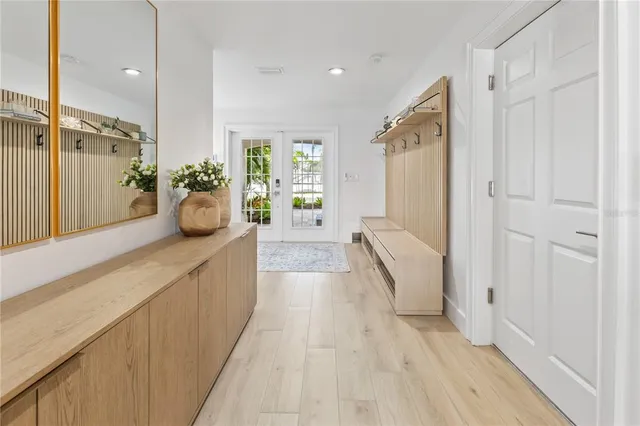 a spacious bathroom with a double vanity sink and mirror