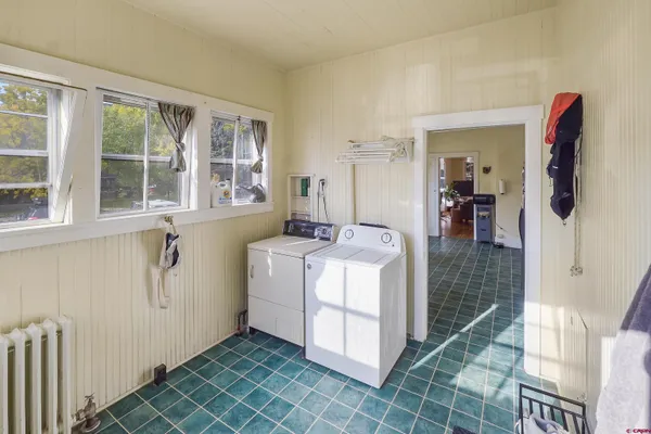 a kitchen with stainless steel appliances granite countertop a stove and a refrigerator