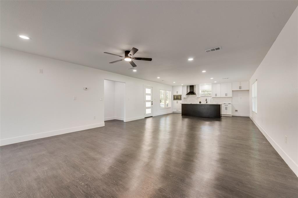 13827 Hiram Road Wills Point, TX 75169 - Photo 12 of 39 a view of empty room with wooden floor and windows