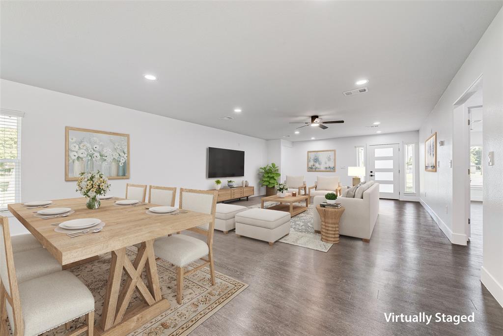 13827 Hiram Road Wills Point, TX 75169 - Photo 13 of 39 a living room with furniture a wooden floor and a flat screen tv