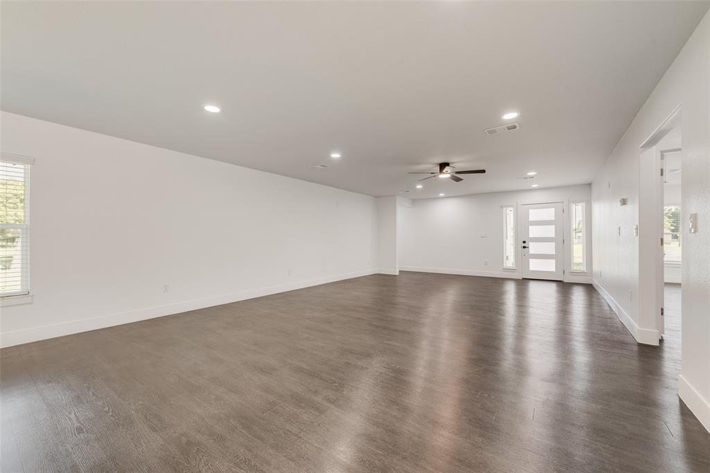 13827 Hiram Road Wills Point, TX 75169 - Photo 39 of 39 an empty room with wooden floor and windows
