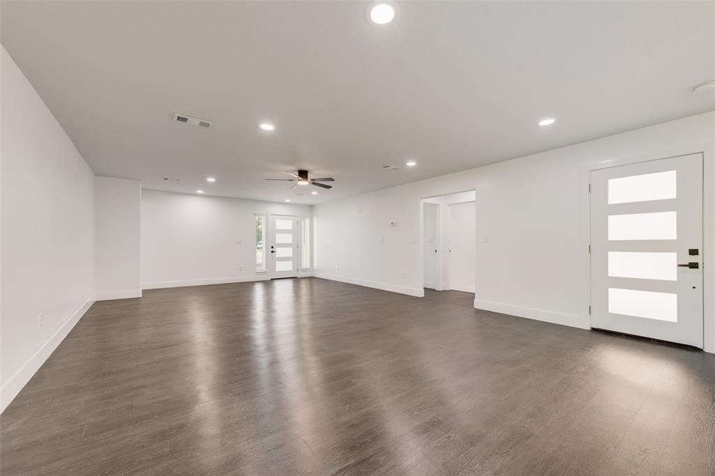 13827 Hiram Road Wills Point, TX 75169 - Photo 14 of 39 an empty room with wooden floor and windows