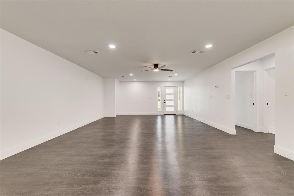 13827 Hiram Road Wills Point, TX 75169 - Photo 15 of 39 an empty room with wooden floor and windows