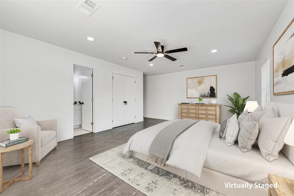 13827 Hiram Road Wills Point, TX 75169 - Photo 16 of 39 a spacious bedroom with a bed and a ceiling fan