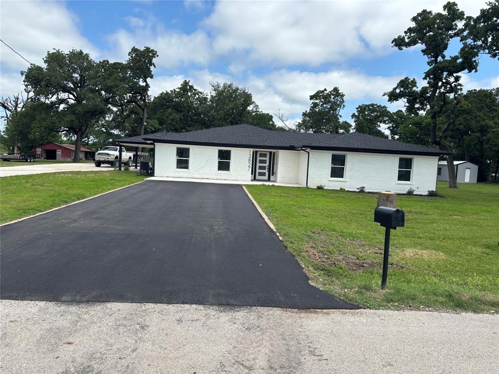 13827 Hiram Road Wills Point, TX 75169 - Photo 2 of 39 a front view of house with yard and green space