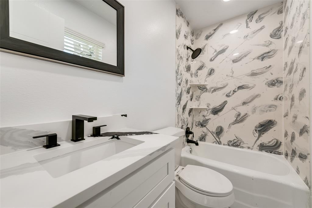 13827 Hiram Road Wills Point, TX 75169 - Photo 24 of 39 a bathroom with a sink a toilet and shower