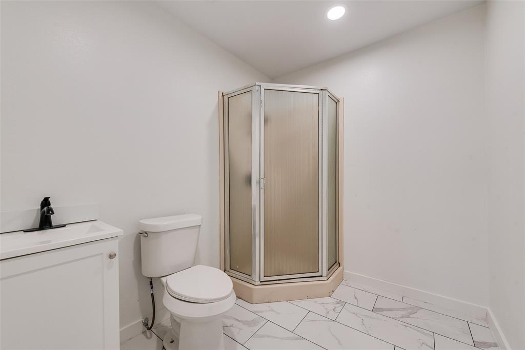 13827 Hiram Road Wills Point, TX 75169 - Photo 38 of 39 a white toilet sitting next to a bathroom sink