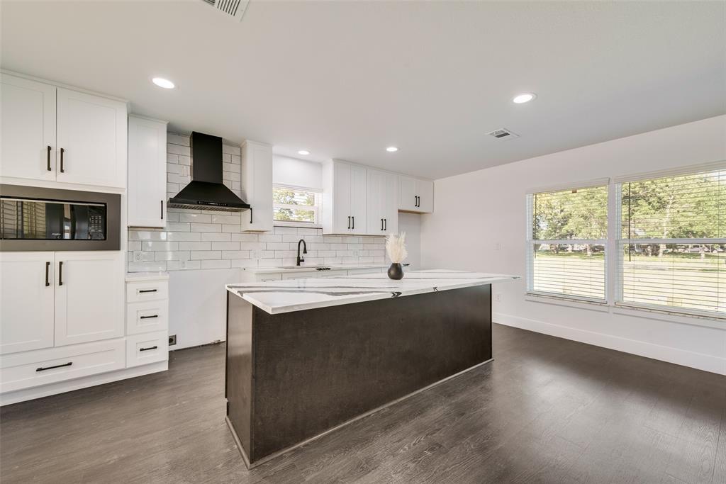 13827 Hiram Road Wills Point, TX 75169 - Photo 8 of 39 a kitchen with a sink stove and microwave