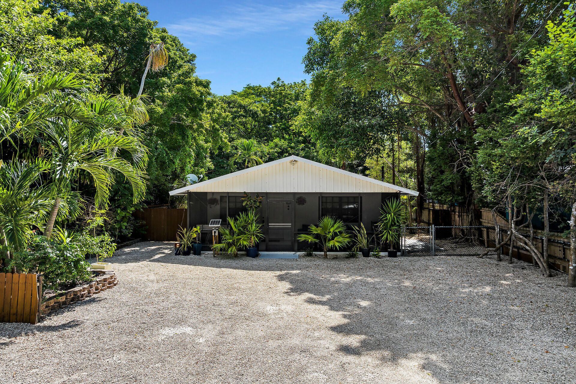 1044 Gibraltar Road Key Largo, FL 33037 - Photo 2 of 29 a garden view with a seating space