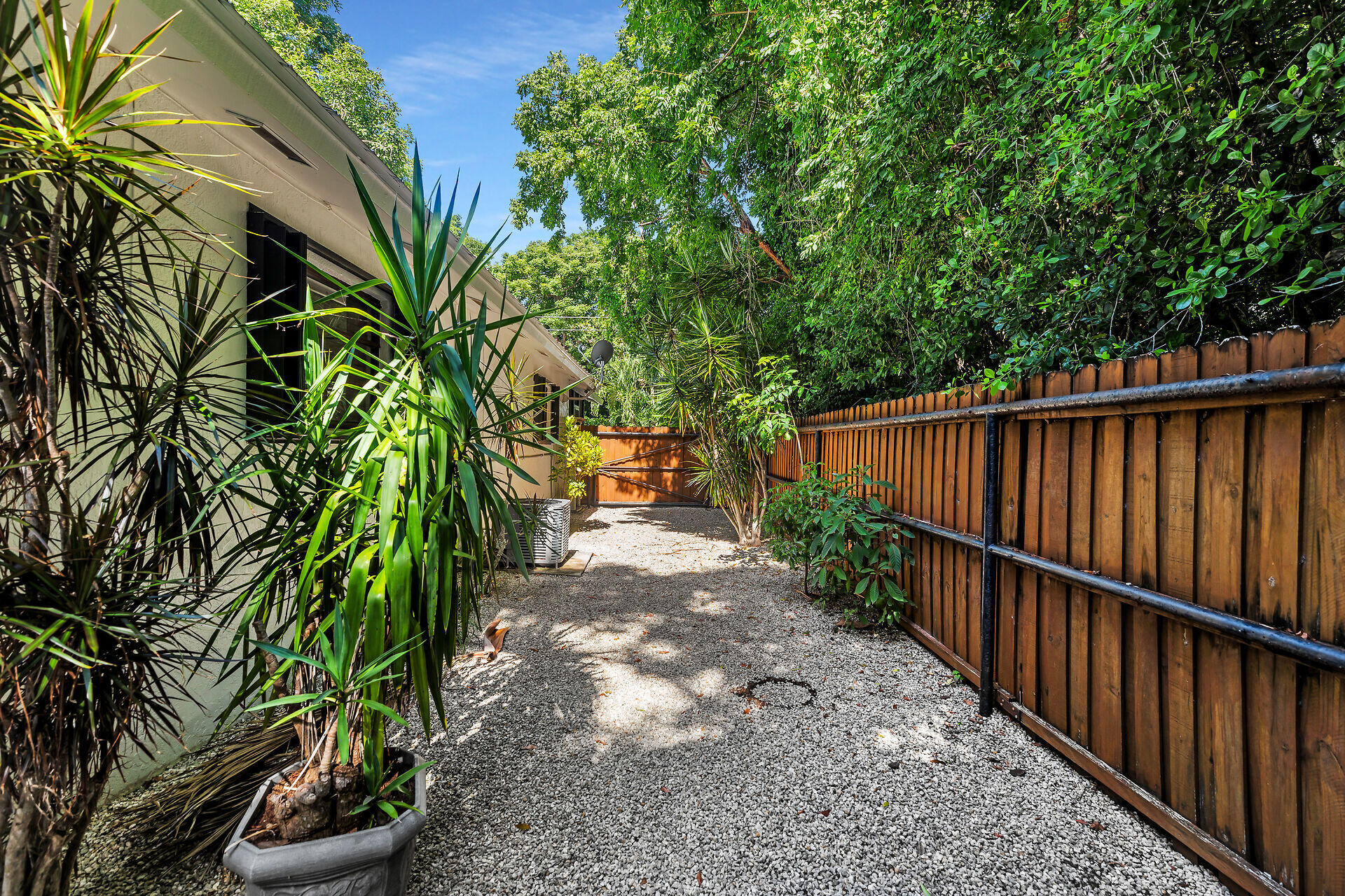 1044 Gibraltar Road Key Largo, FL 33037 - Photo 25 of 29 a view of a backyard with plants