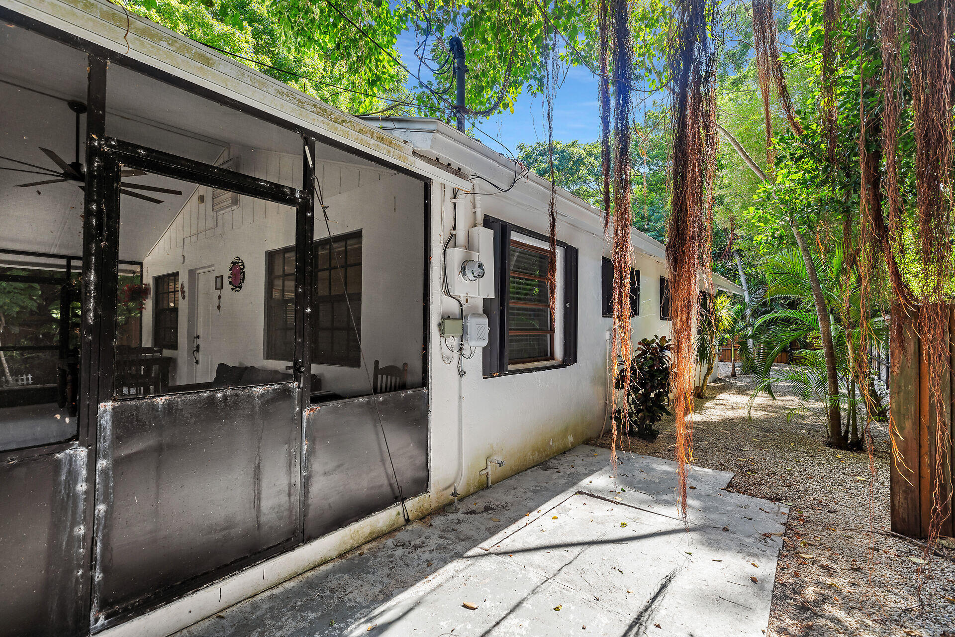 1044 Gibraltar Road Key Largo, FL 33037 - Photo 26 of 29 a backyard of a house with seating space
