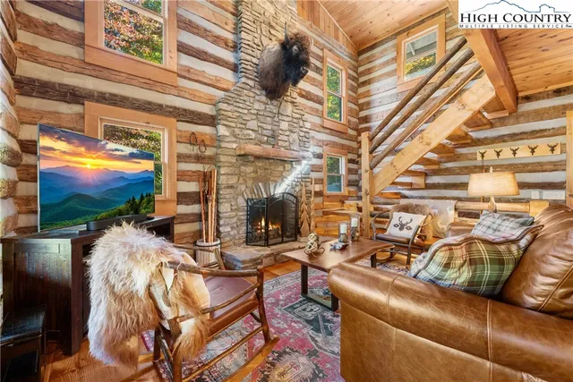 a view of a living room with furniture and a flat screen tv