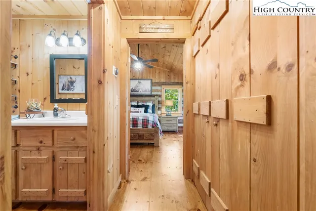 a en suite bathroom with a sink a mirror and shower