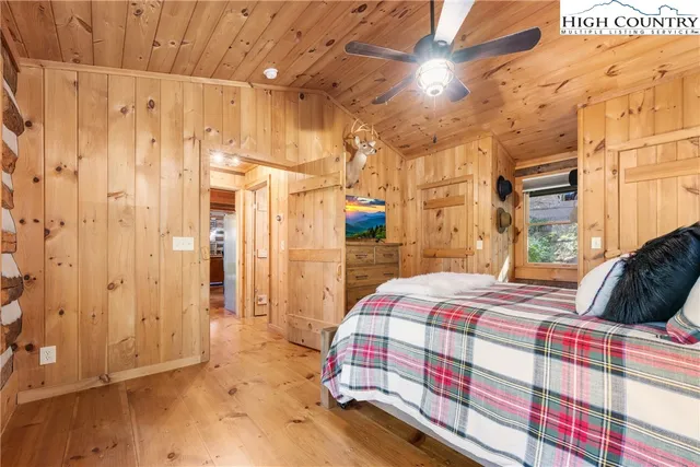 a bedroom with a bed and a walk in closet