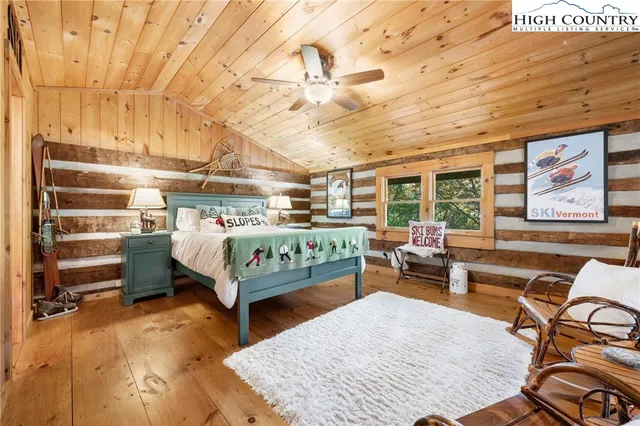 a bed room with furniture and a chandelier