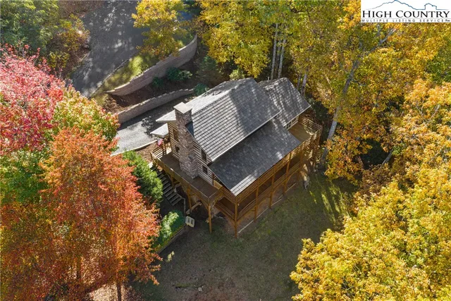 a view of stairs and yard with green space