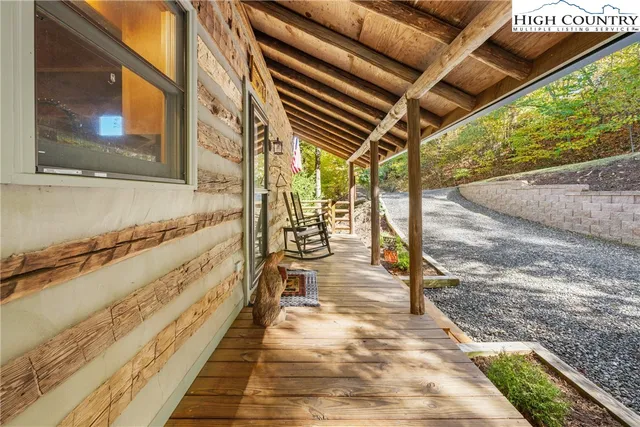 a view of a porch with wooden floor