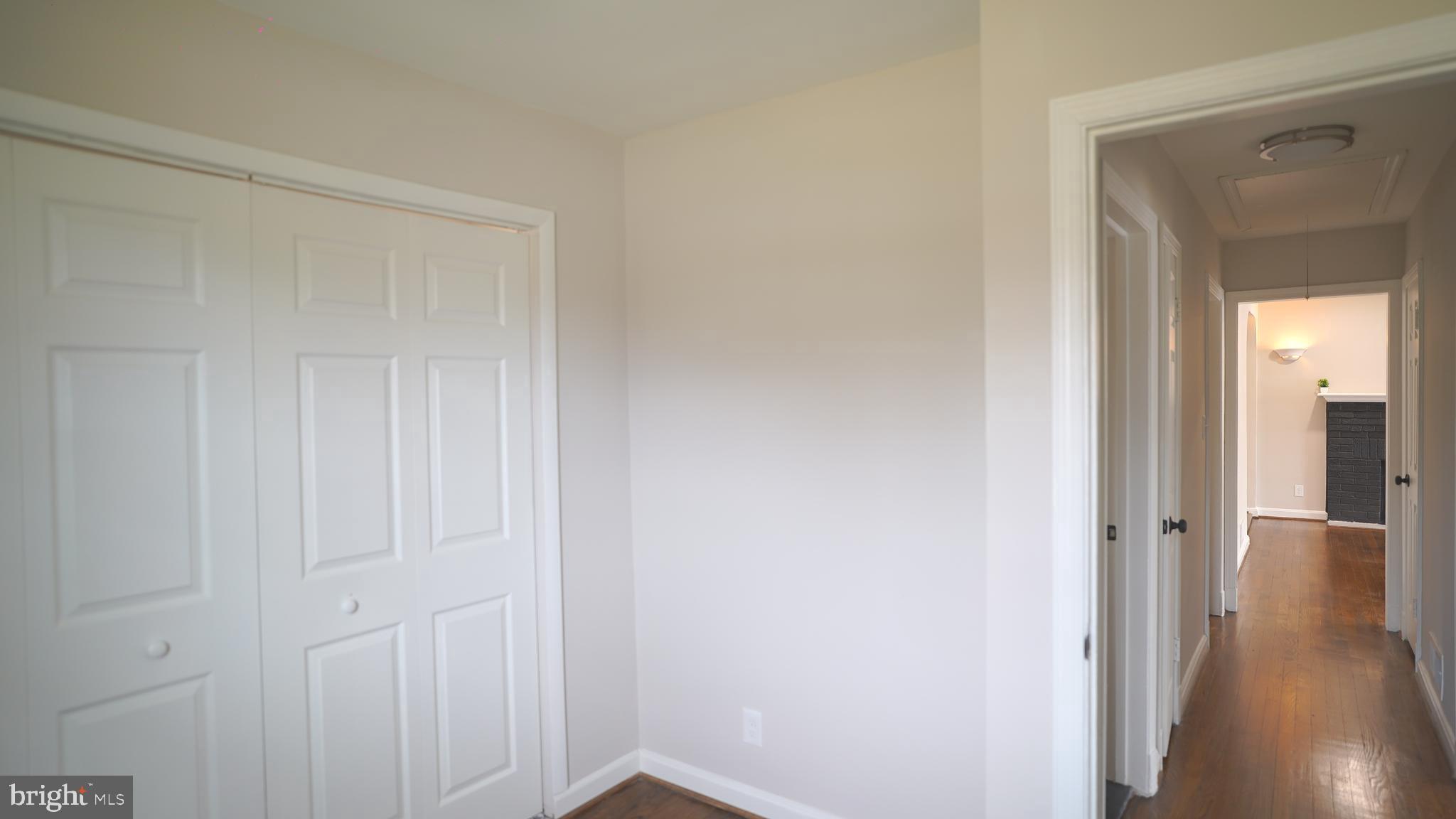 9300 Worrell Avenue Lanham, MD 20706 - Photo 14 of 63 a view of a hallway with wooden floor