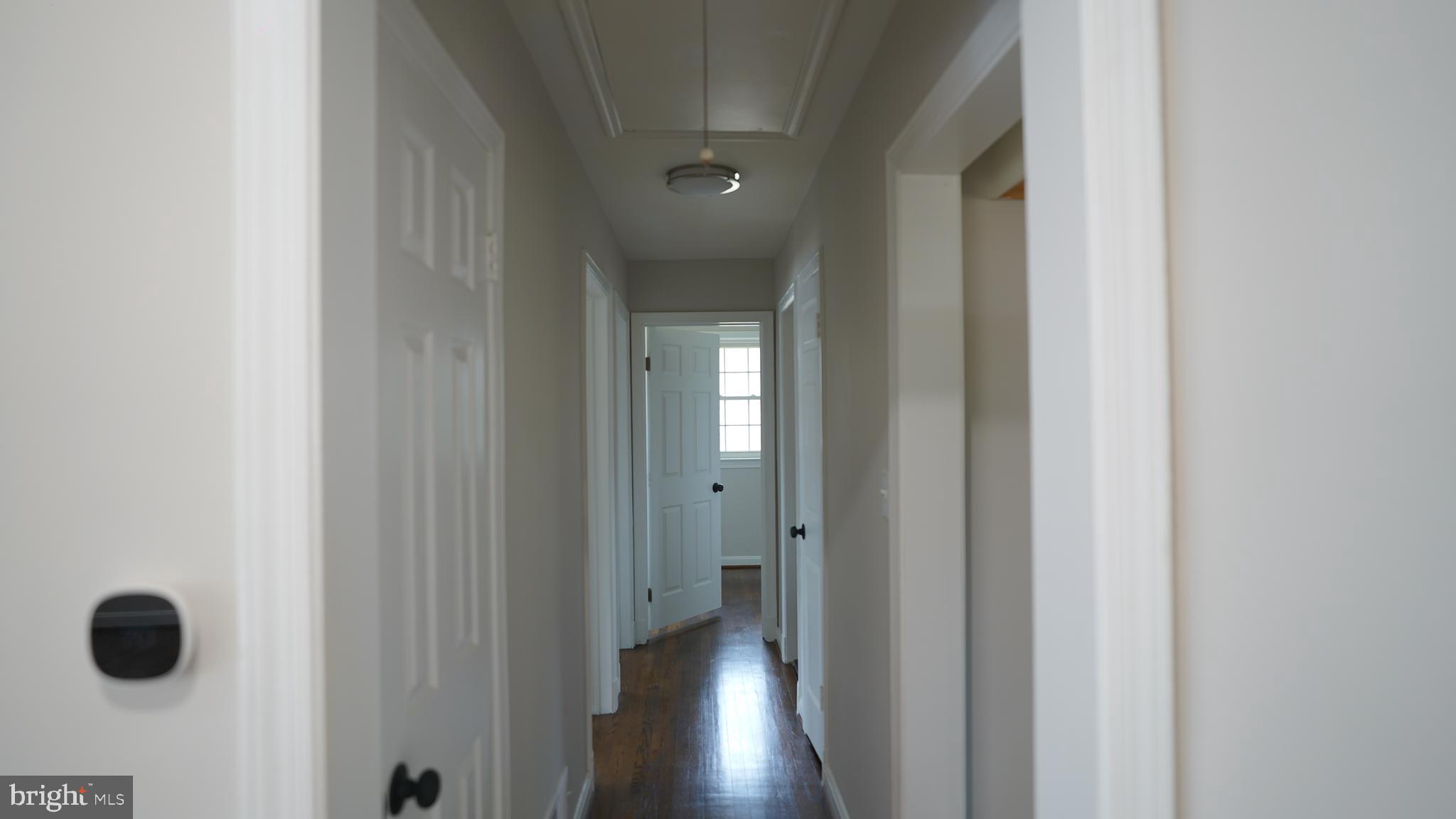 9300 Worrell Avenue Lanham, MD 20706 - Photo 16 of 63 a view of hallway with wooden floor
