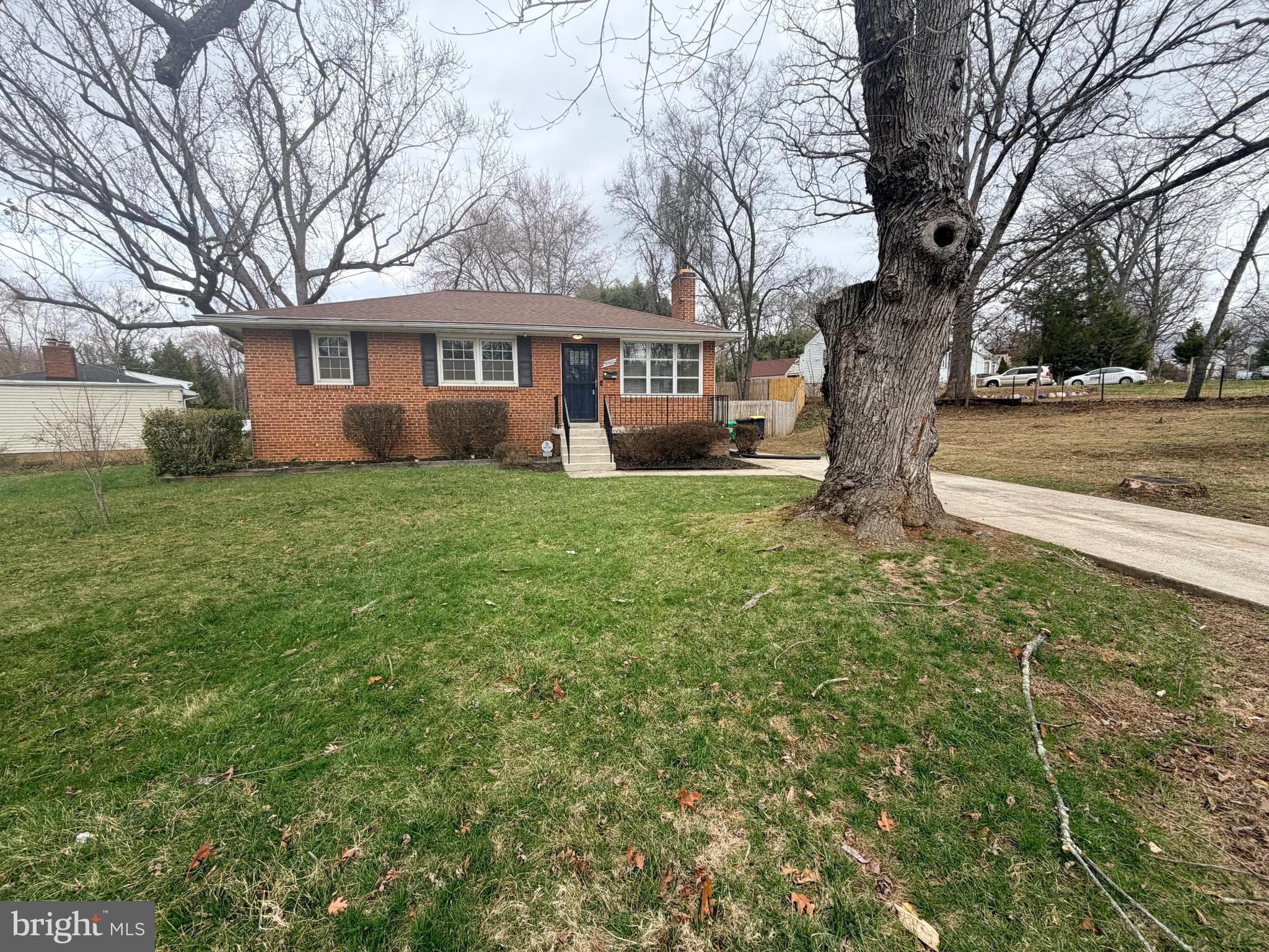 9300 Worrell Avenue Lanham, MD 20706 - Photo 2 of 63 a tree in the house next to a yard