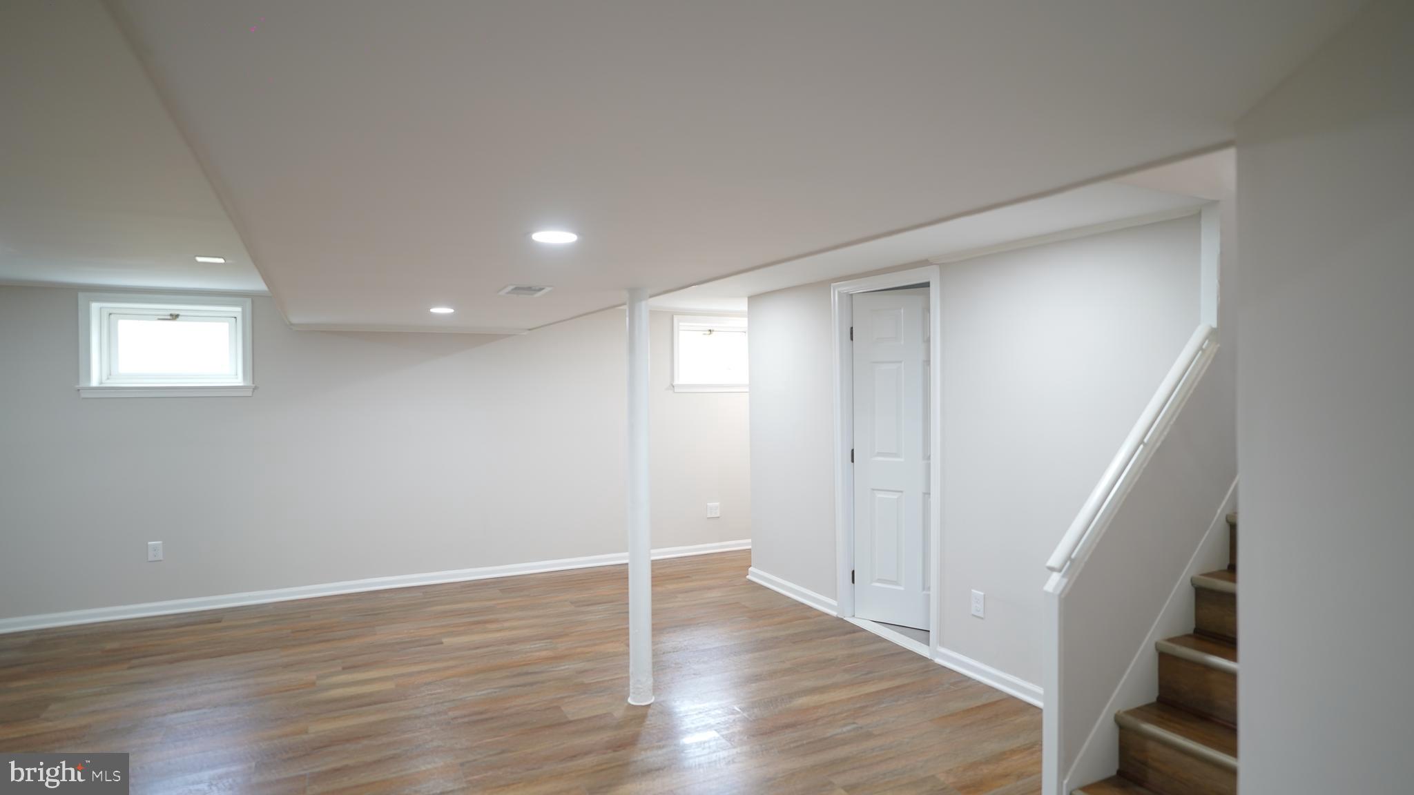 9300 Worrell Avenue Lanham, MD 20706 - Photo 26 of 63 a view of an empty room with wooden floor and a window