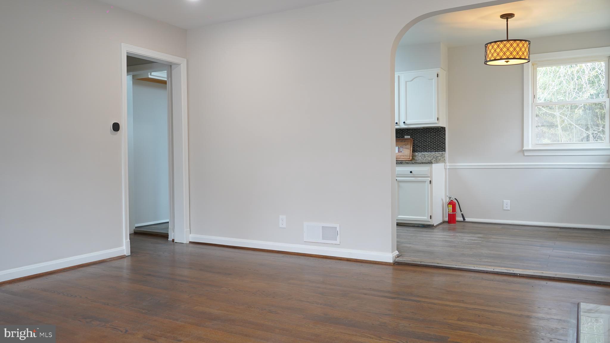 9300 Worrell Avenue Lanham, MD 20706 - Photo 5 of 63 an empty room with wooden floor and window