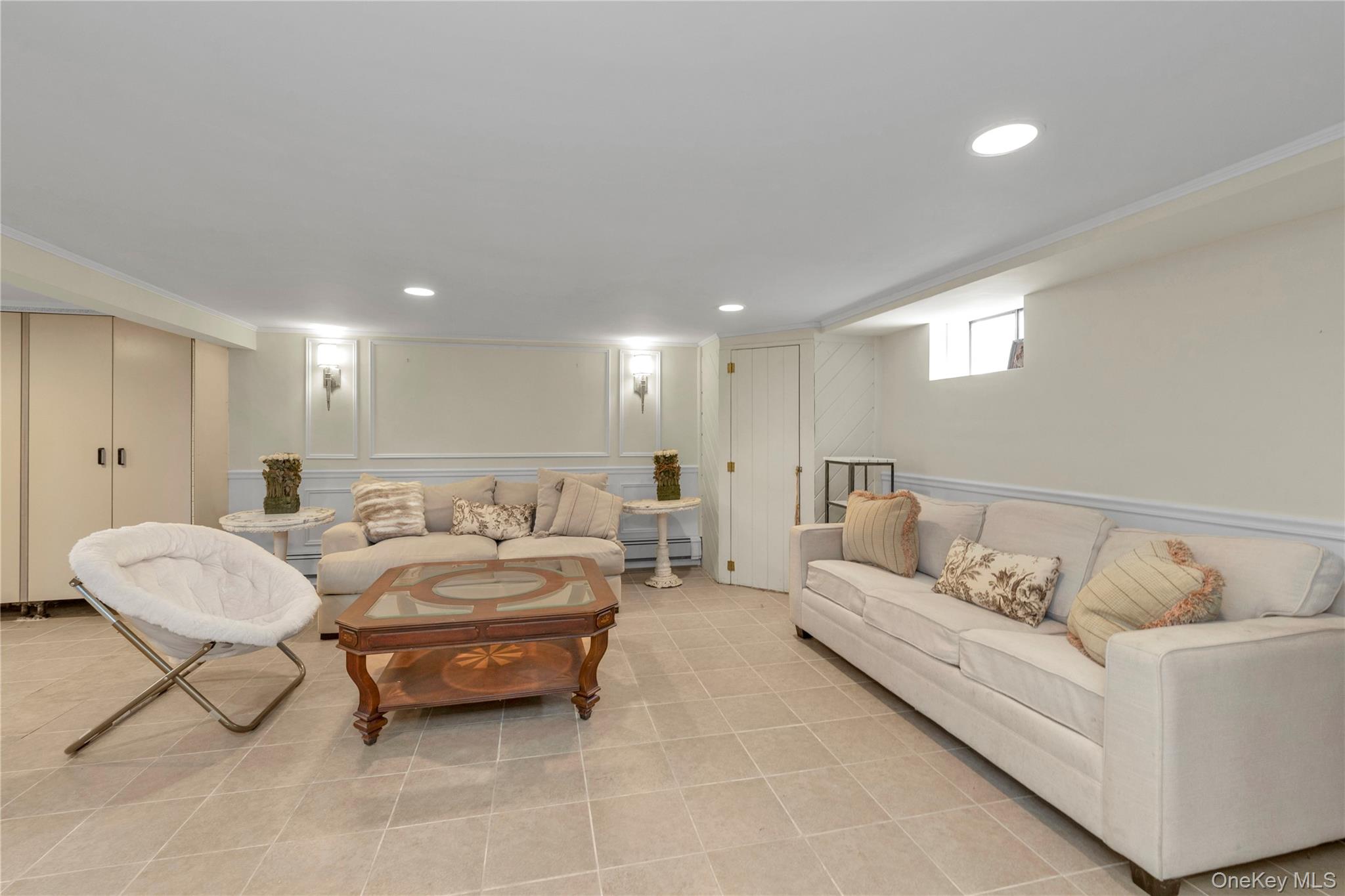 23 Grove Street Cold Spring Harbor, NY 11724 - Photo 17 of 21 a living room with furniture and a couch