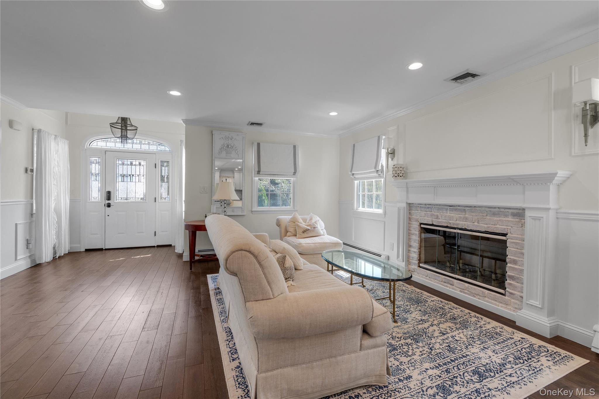 23 Grove Street Cold Spring Harbor, NY 11724 - Photo 3 of 21 a living room with furniture and a fireplace