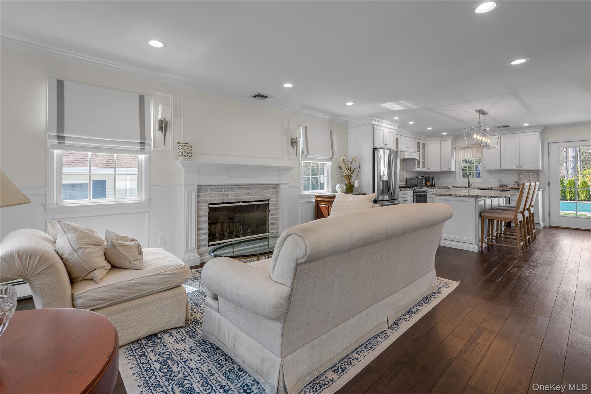 23 Grove Street Cold Spring Harbor, NY 11724 - Photo 4 of 21 a living room with furniture and a fireplace