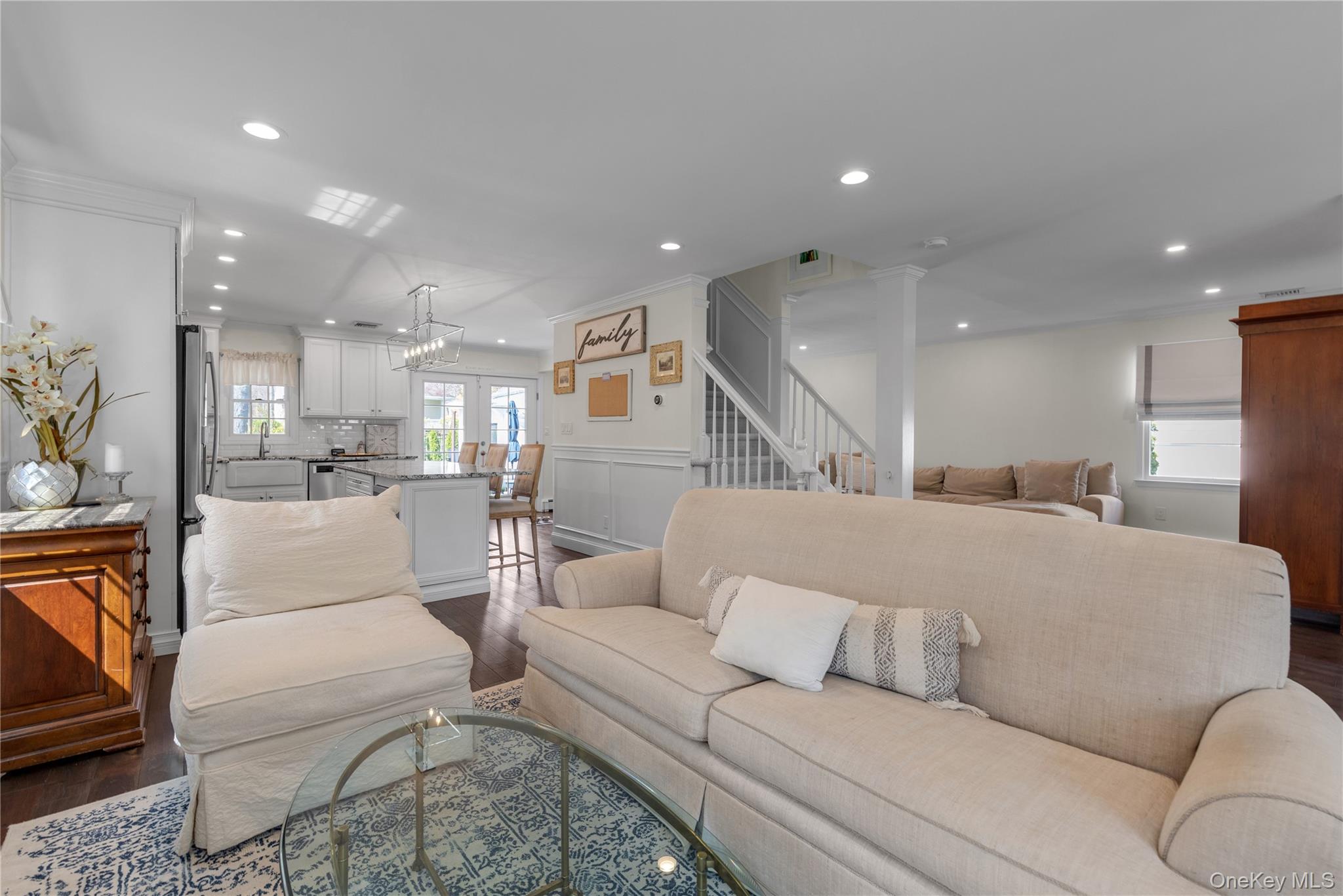23 Grove Street Cold Spring Harbor, NY 11724 - Photo 5 of 21 a living room with furniture and kitchen view