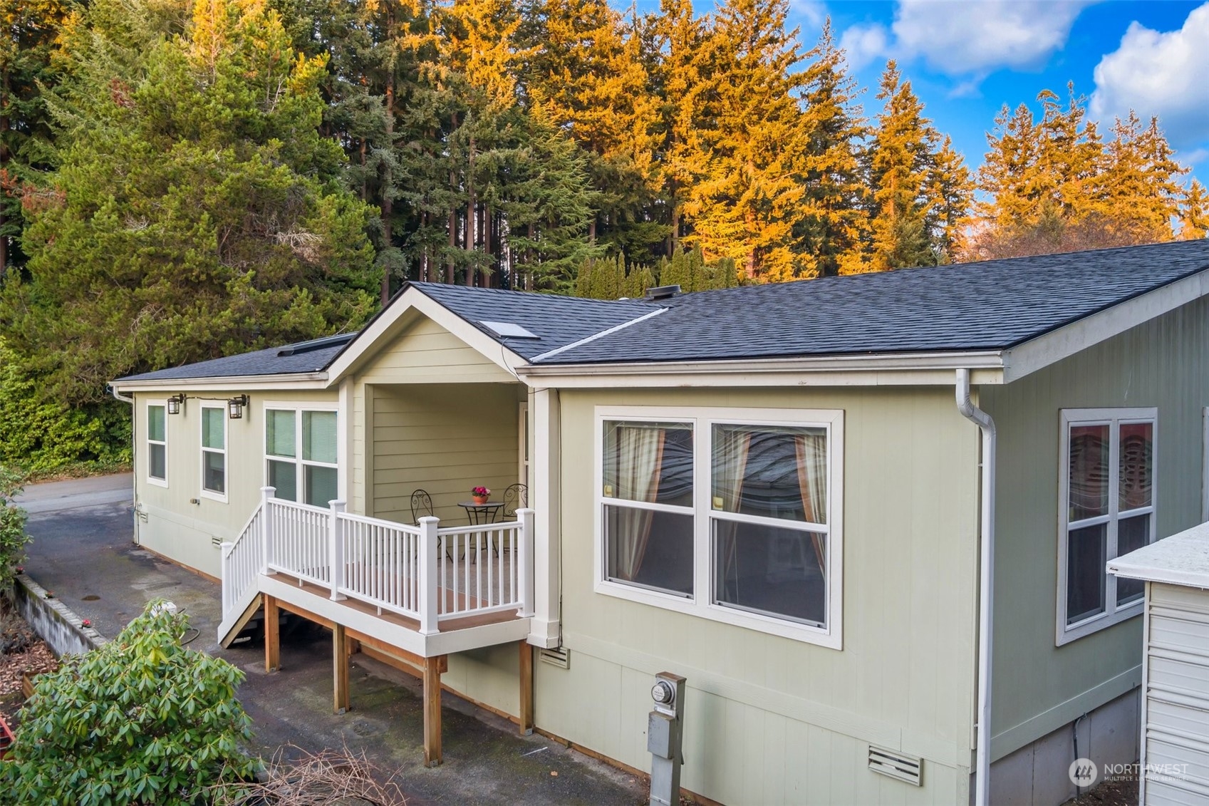 3324 206th Place Southeast Bothell, WA 98012 - Photo 1 of 34 a house with a trees in the background